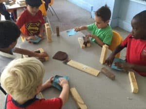 Kids from the French american academy building blocks in an enrichment session